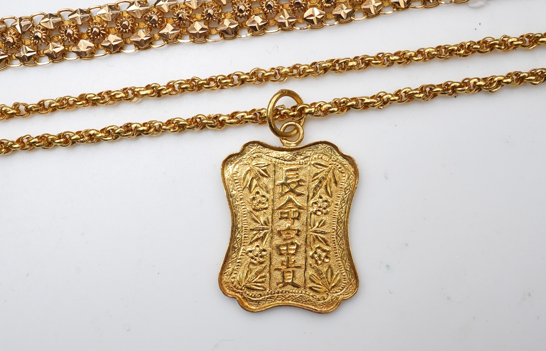 A Chinese pendant necklace and two gold bracelets